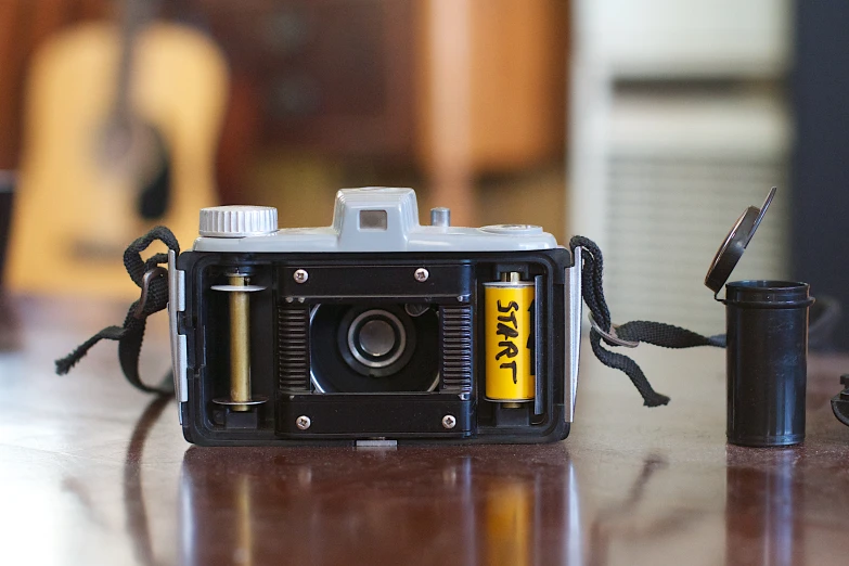 an old fashioned camera sitting next to an old one