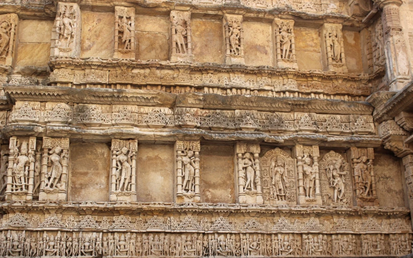 a close up of a building with carvings on it