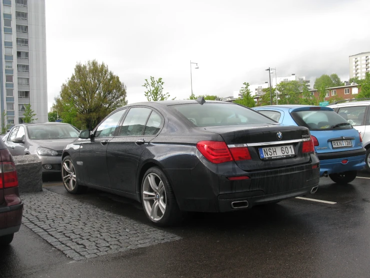 a couple of cars parked next to each other on a street