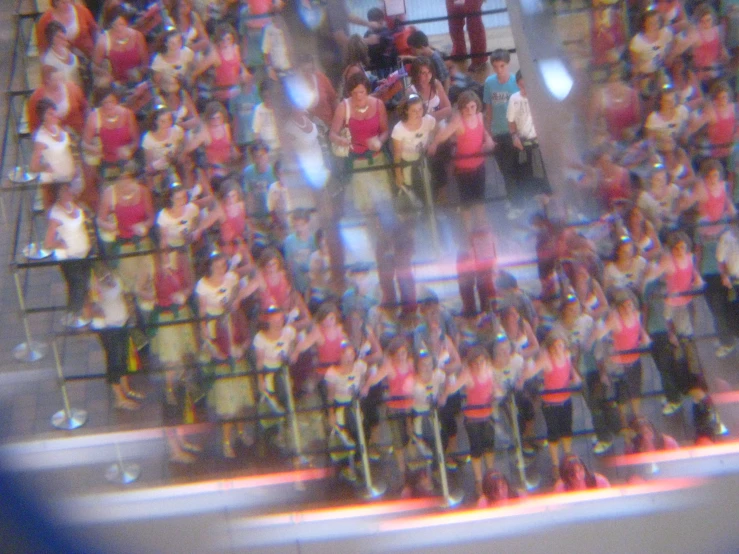 people are standing together in front of a mirror