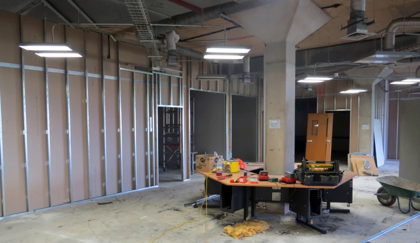 an unfinished room with an abundance of appliances