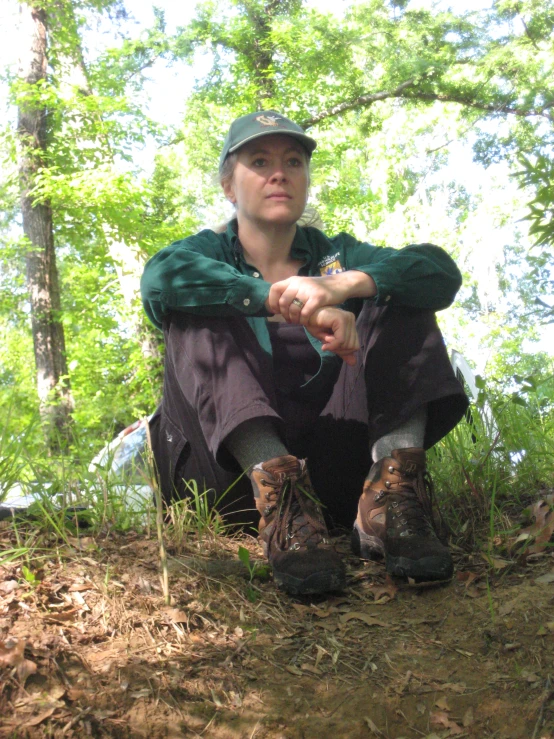 a person with a hat, boots and jacket