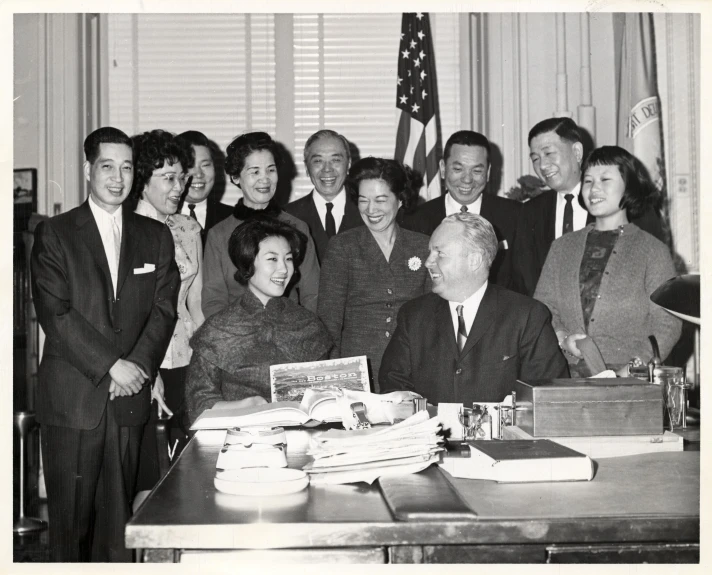 a group of asian people posing for a picture