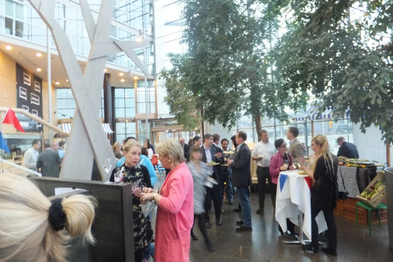 people are gathered in an indoor cafe area