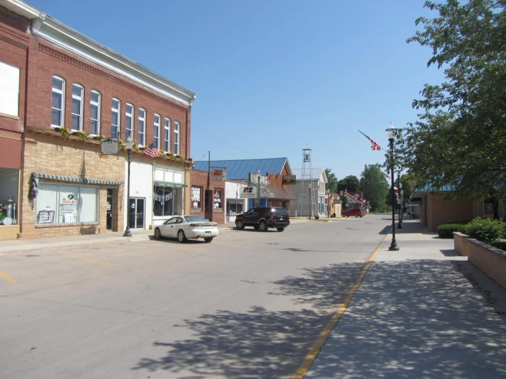 a row of shops in the corner of a street