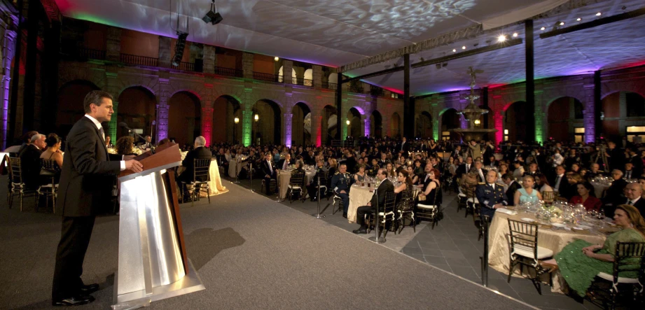 a man giving a speech at a gathering