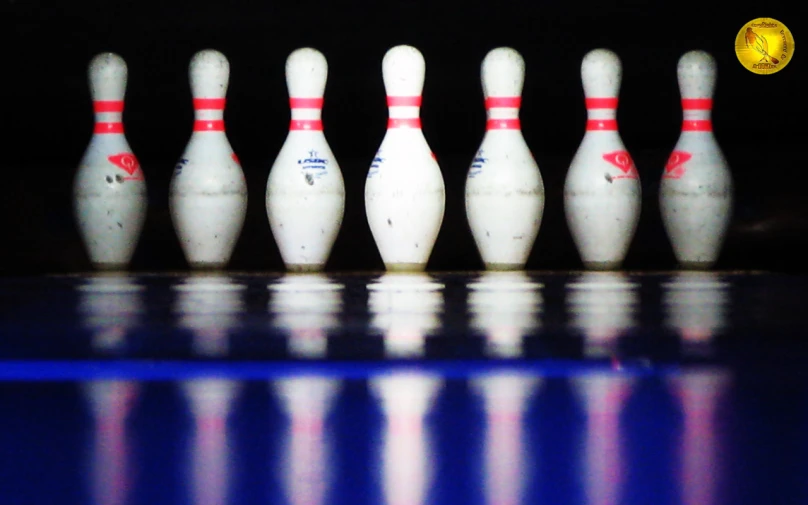 a close up of a bowling ball set up in bowling alley