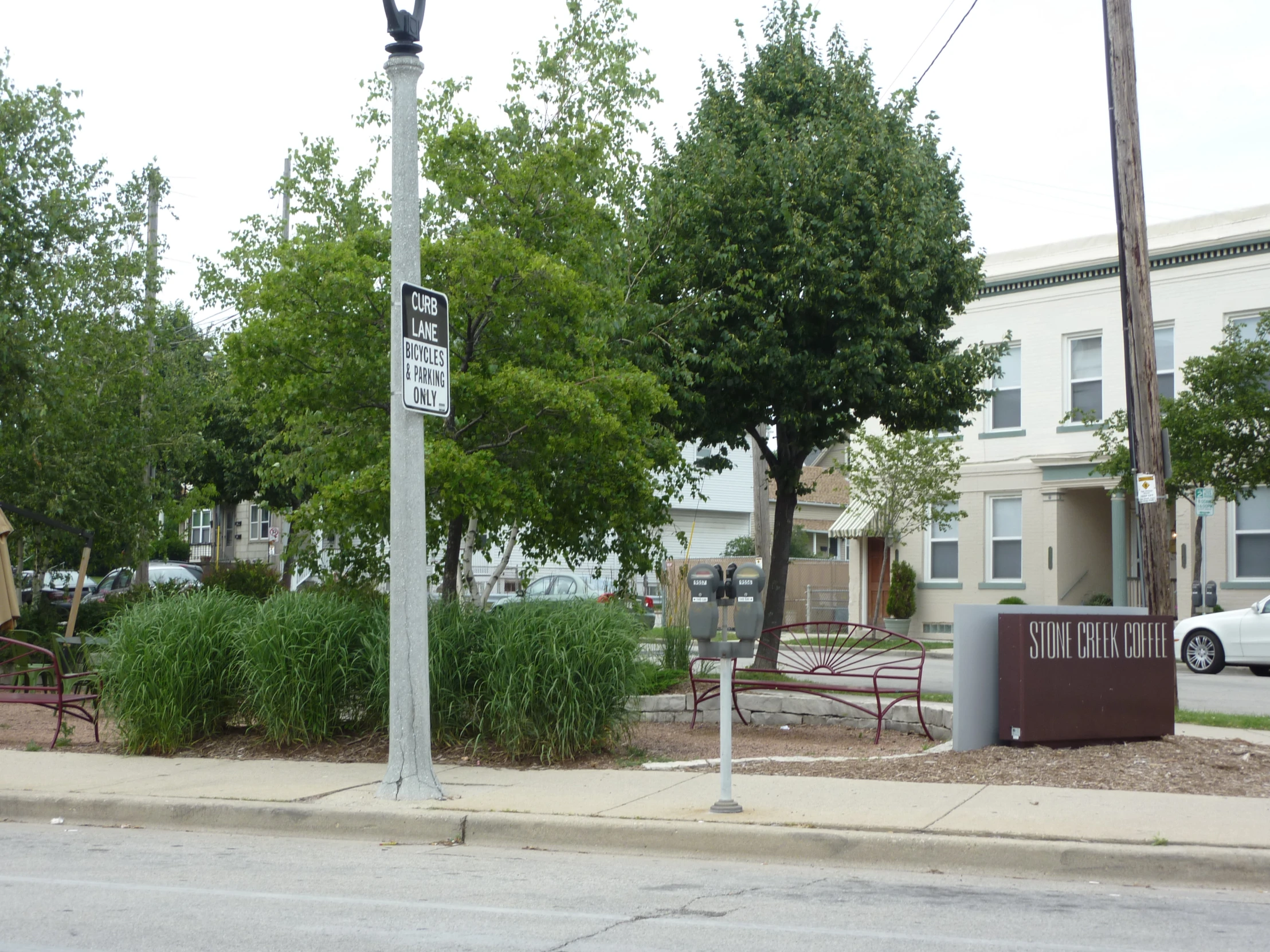 an old stop sign on the corner of a street