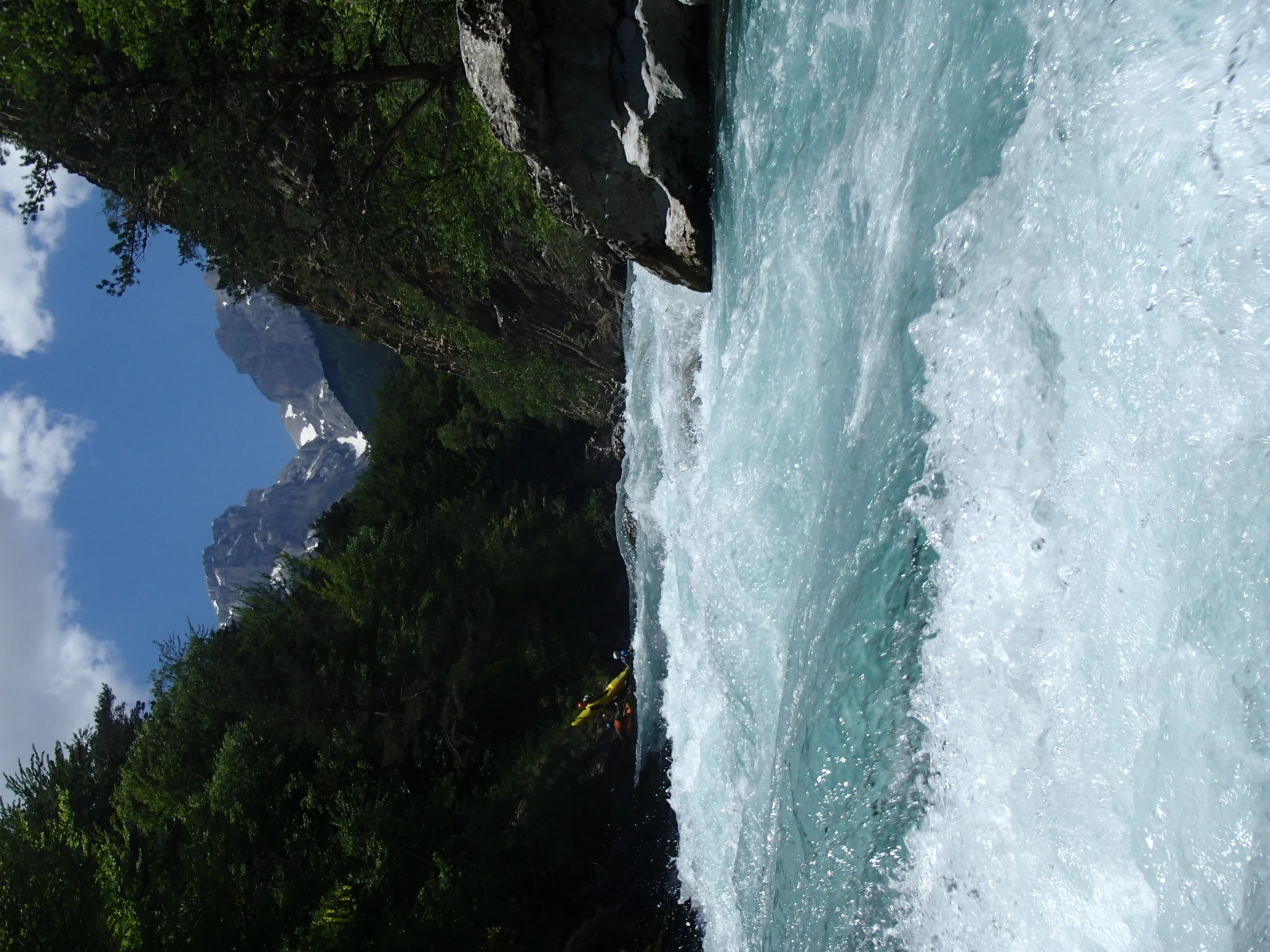 a person surfing some blue water on a river