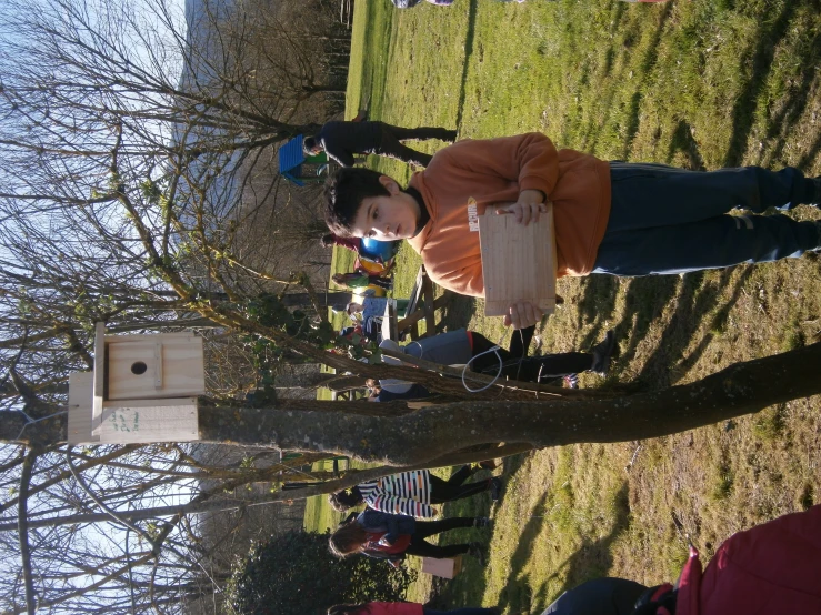 a person is wearing a sweatshirt and a bird house