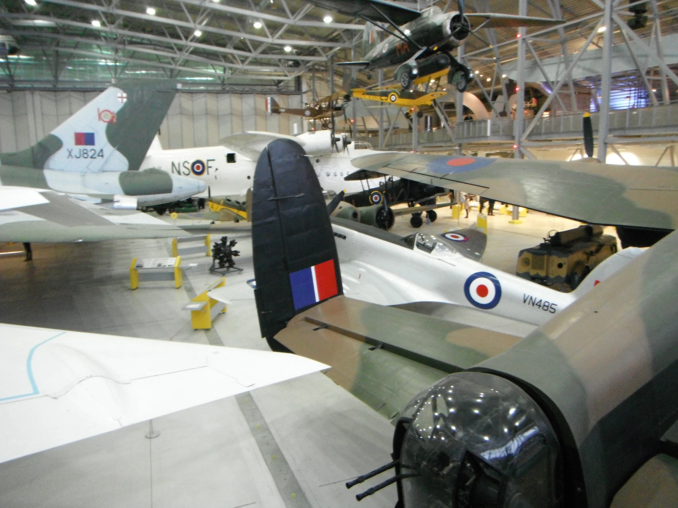 planes are parked in a hanger for maintenance