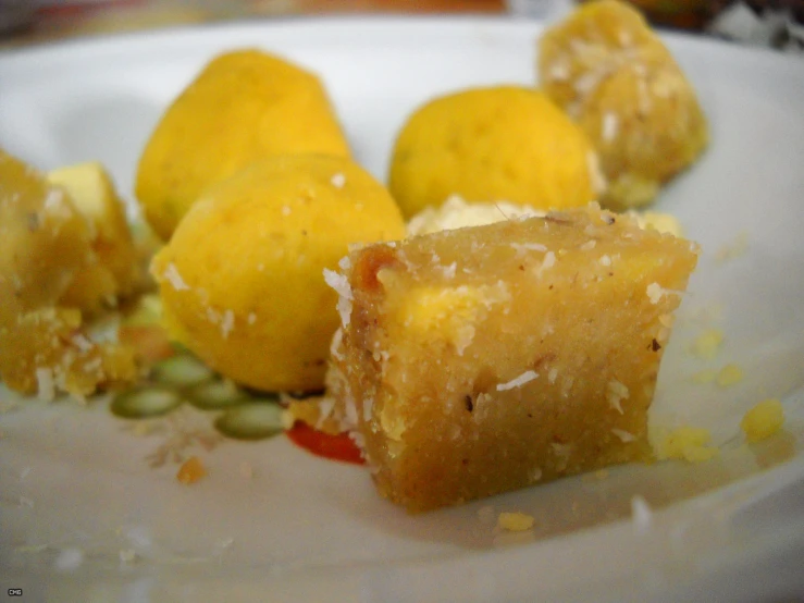 a white plate filled with lemons and some other food