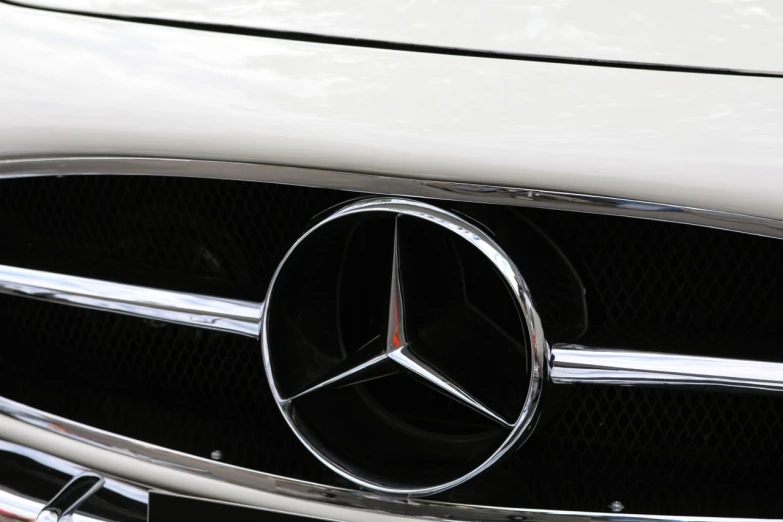 the mercedes logo is shown on a car