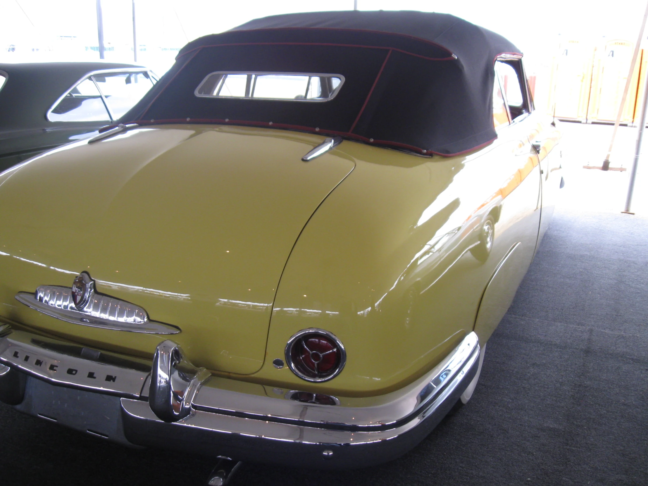 an old car is parked inside a building