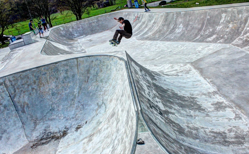 some people on skateboards at a park