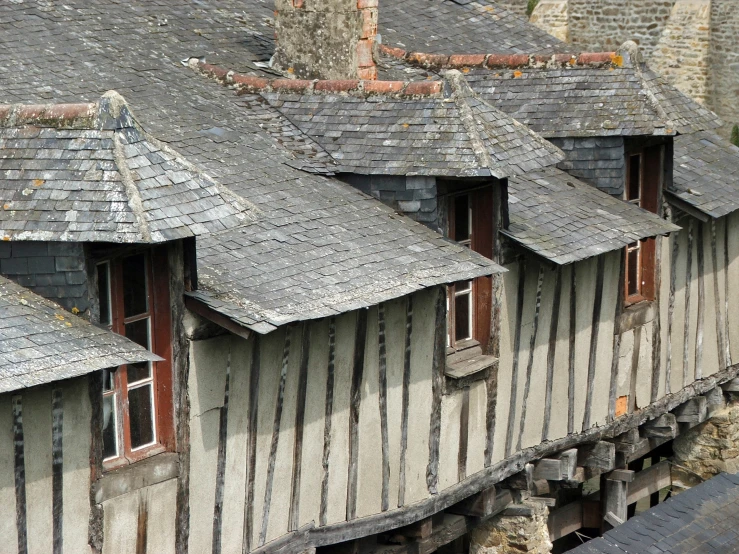 a number of windows on a building with many small brick buildings