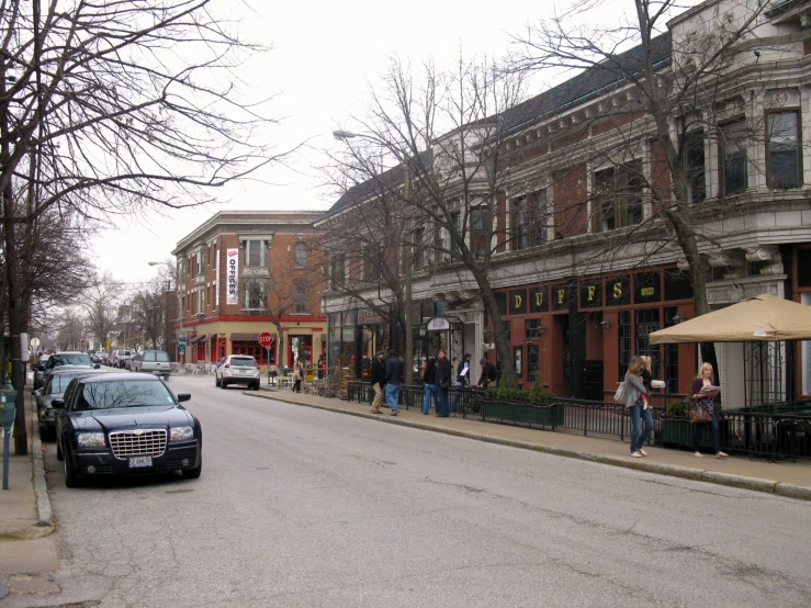 an image of people walking down a street