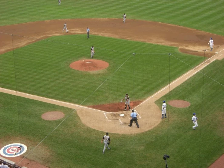 a baseball game with players on the field and in action