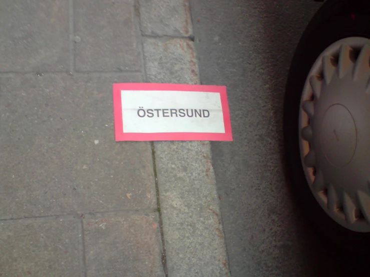 an osterund sign is propped up on the curb