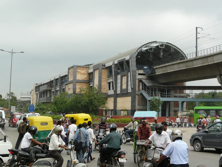 people riding on bikes in the road