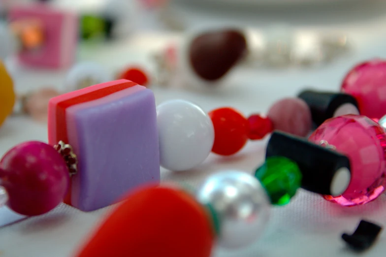 a close - up view of a necklace with jewelry and pearls