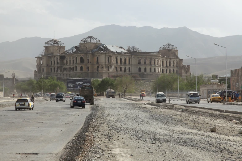 an old, run down city with several buildings and a few people