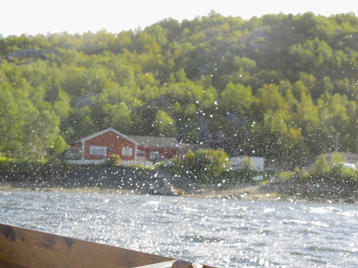 a house on the shore of a body of water