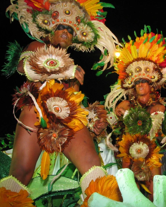 two woman in exotic attire at a parade