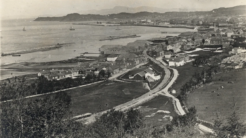 an aerial view of a town in a vintage po