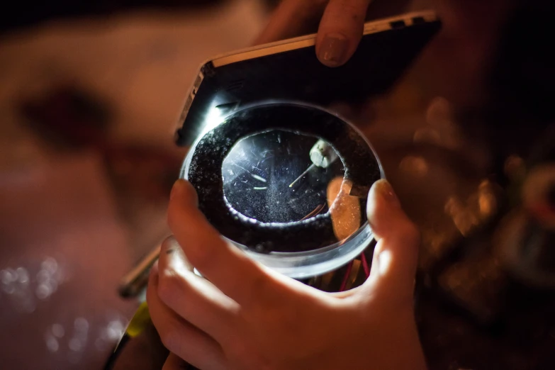 a close up image of a clock and a cellphone