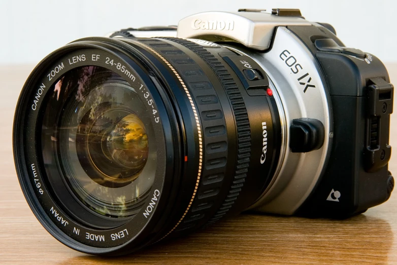 an image of a camera with its lens attached