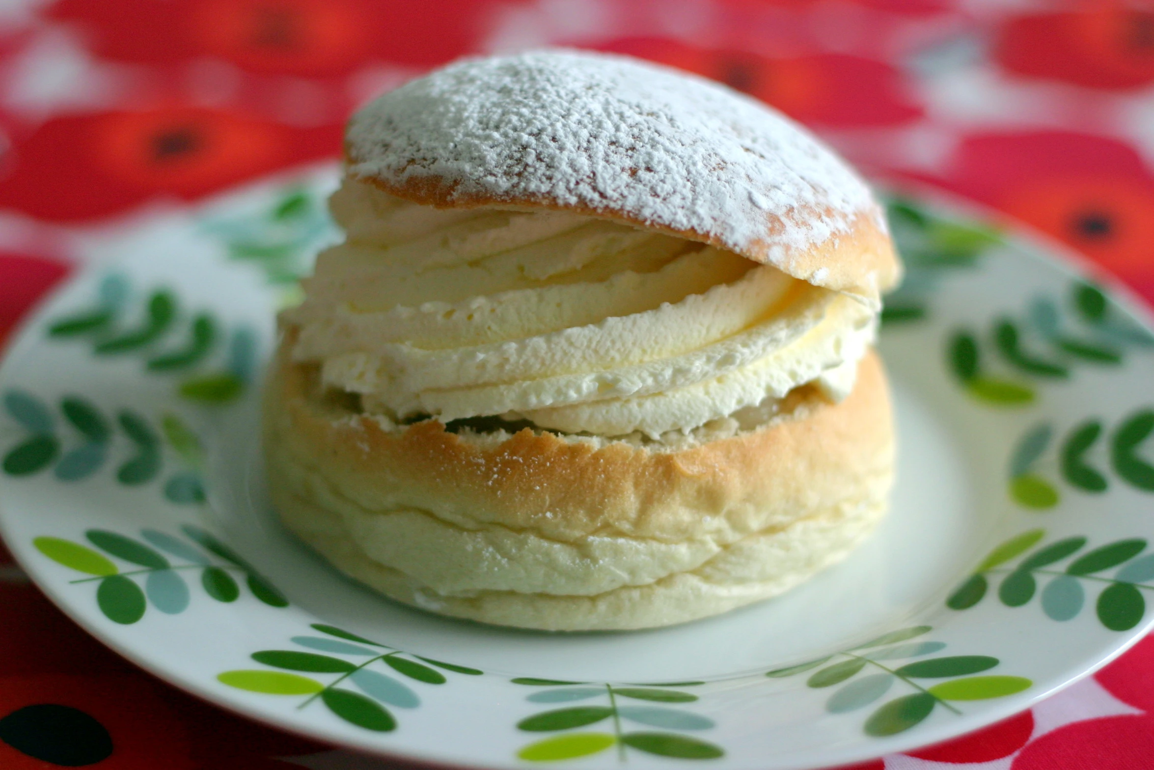 a sugar covered pastry sitting on top of a plate