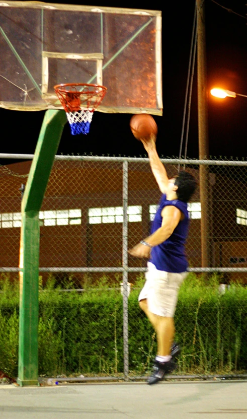 a man who is getting ready to dunk a basketball