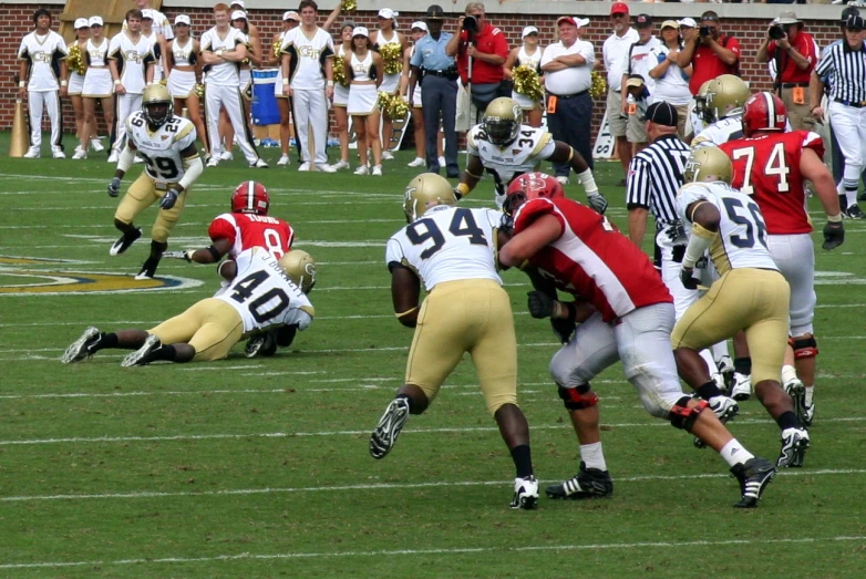 a team playing football with a man in the middle of the game