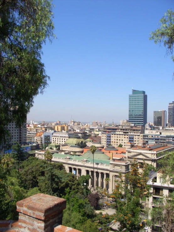 a city and a blue sky in the background