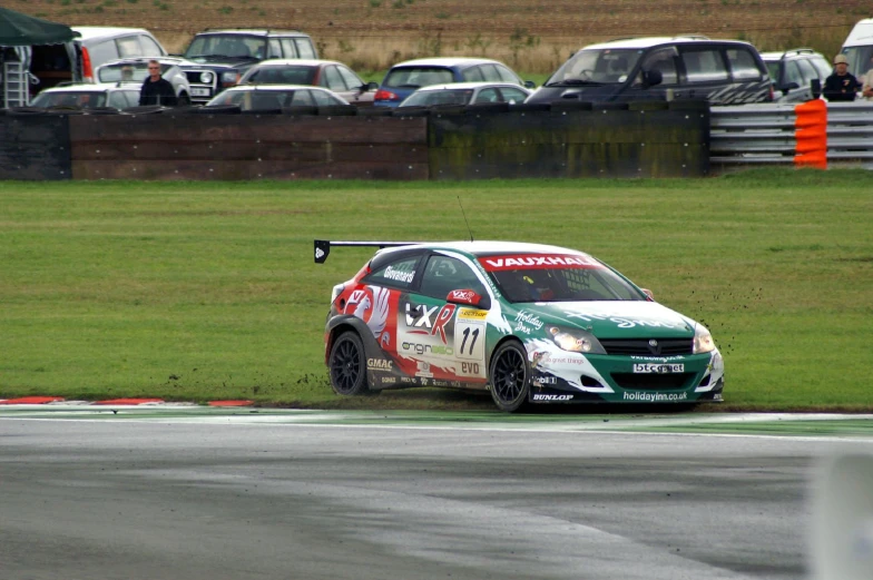 a car on the track near some cars