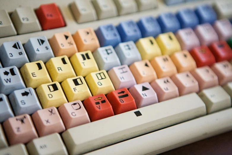 a computer keyboard with colorful keys and numbers