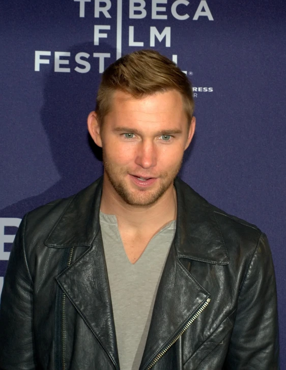 a close up of a person wearing a leather jacket