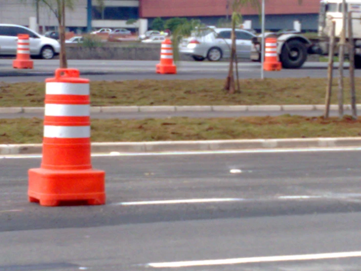 a street sign and some orange traffic cones