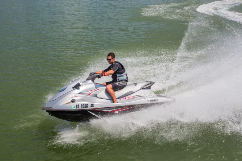 a man on a jet ski riding in water