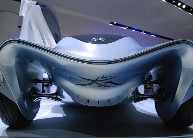a car sitting on display at an exhibit