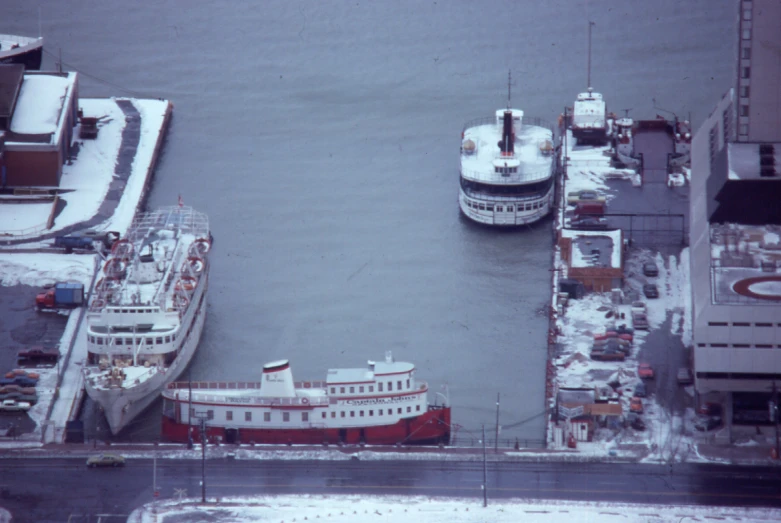an aerial view of two ships in the water