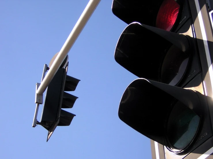 the light on the pole is red and shows a red signal