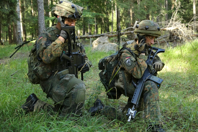 a group of military personnel on the ground