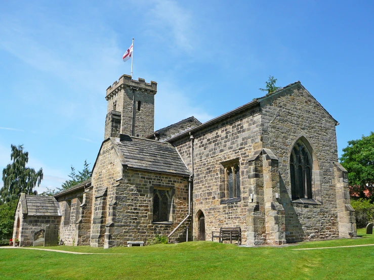 a stone church with two tall spires on top of it