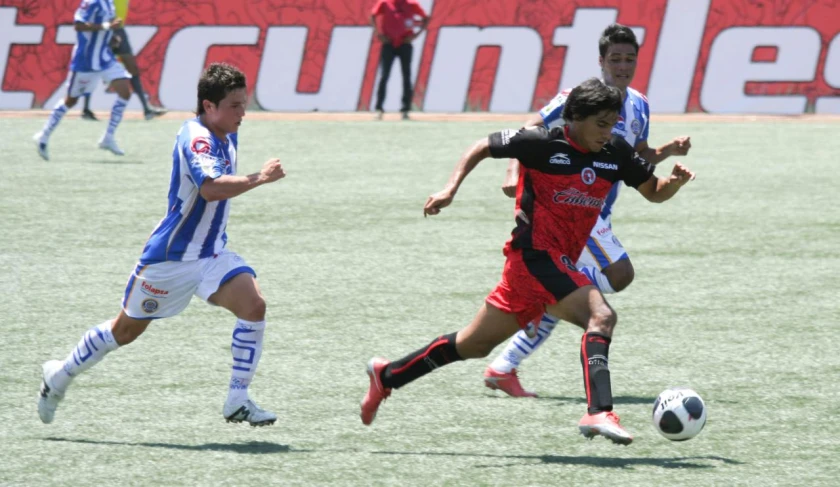 a couple of soccer players are on a field