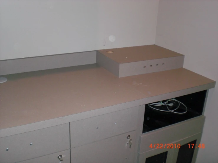 two boxes and several drawers are in a room