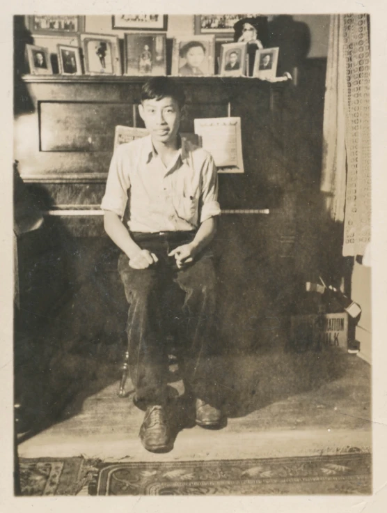 a man sitting in front of a piano