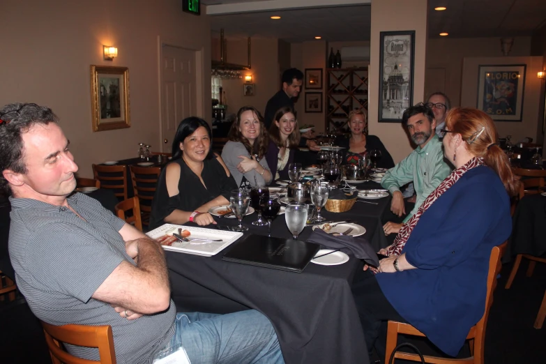 a group of people sitting at a table