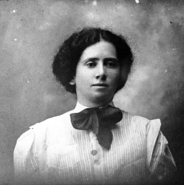 black and white pograph of a woman wearing a bow tie